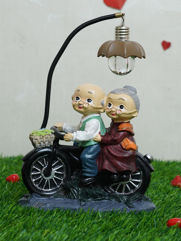 Black and Beige Old Age Love Couple With Led Light Showpiece
