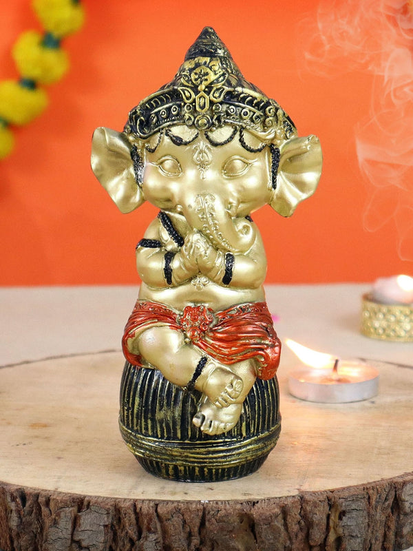 Metallic-Toned and Black Textured Bal Ganesha Idol Showpiece