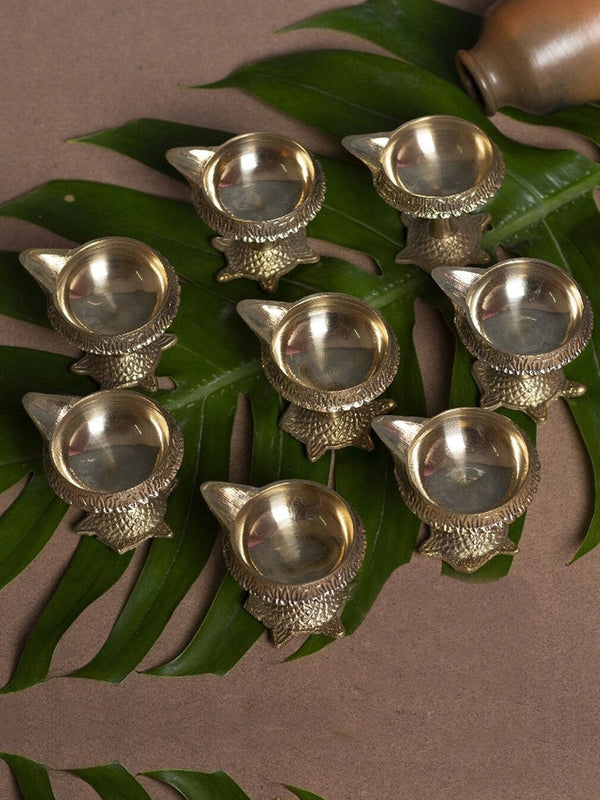 Gold Toned 8 Pieces Decorative Brass Diyas With Tortoise Base