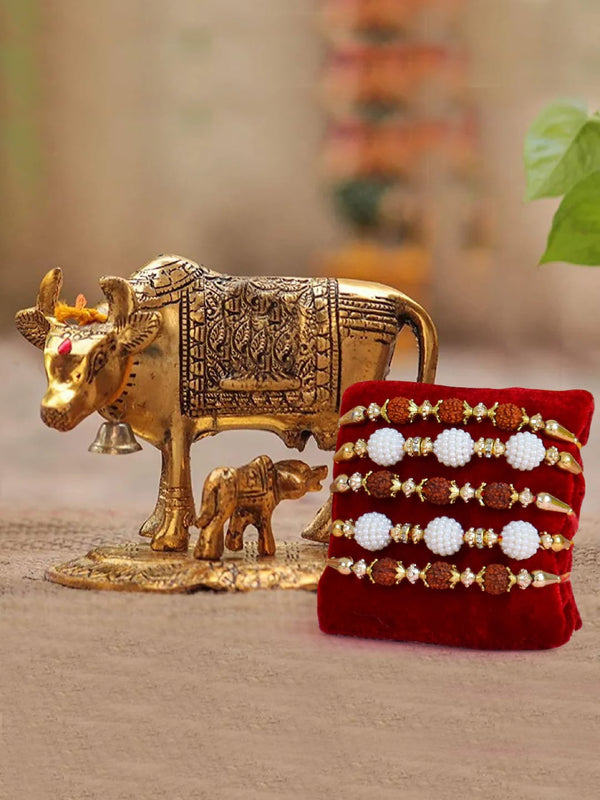 Red & White Set Of 5 Rakhi & Cow Idol With Calf Idol